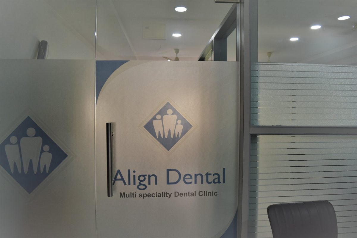 The Align Dental entrance in Madhapur, with the clinic name etched on the glass