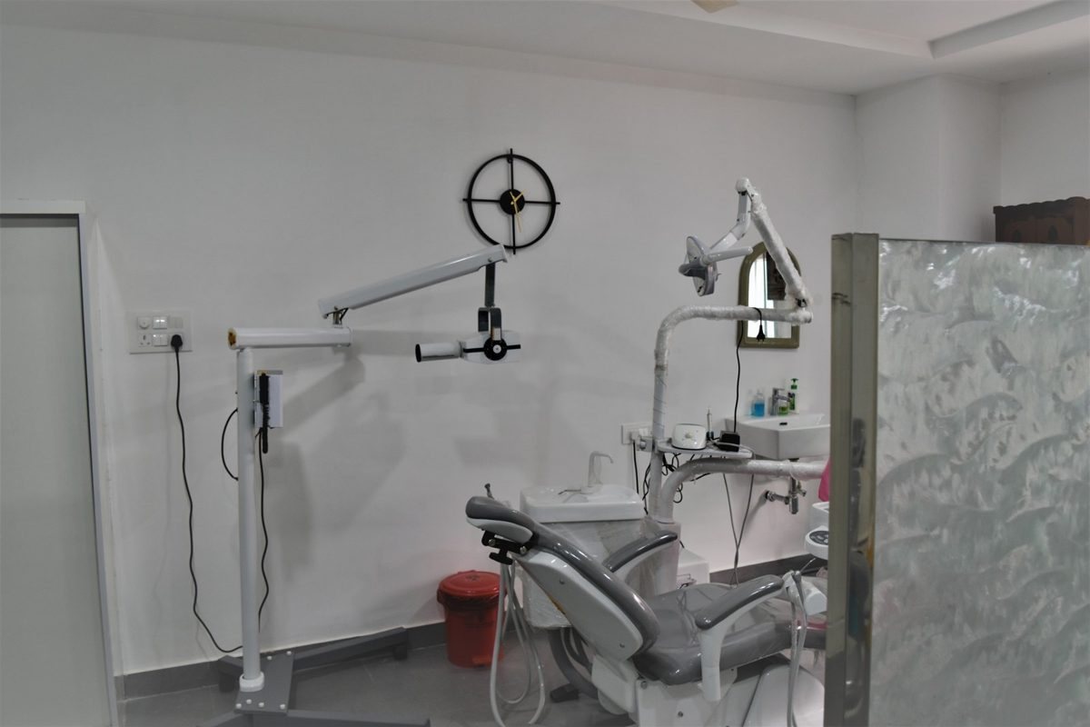 A treatment room at Align Dental, with the chair and the wall-mounted X-ray arm