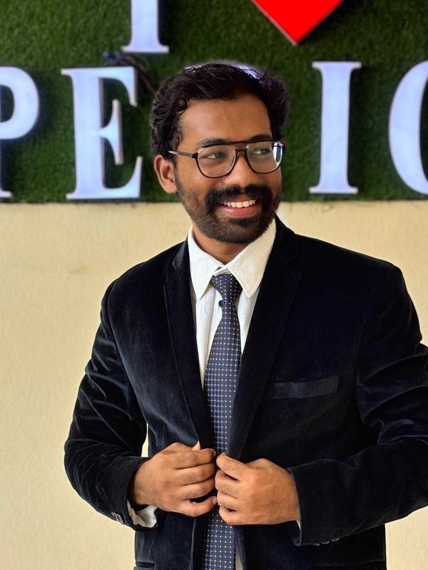 Dr. Jajam Sai Krishna Manikanta in a dark suit