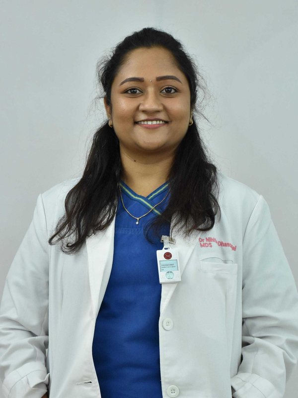 Dr. D. Nihitha Dhanunjai in a white coat